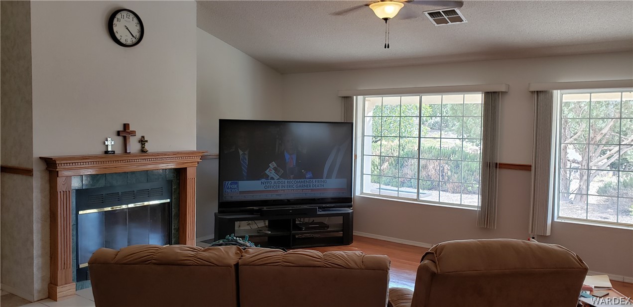 10002 East Blake Ranch Road, Unit 3 Kingman, AZ 86401 - Photo 15 of 42 a living room with furniture and a fireplace