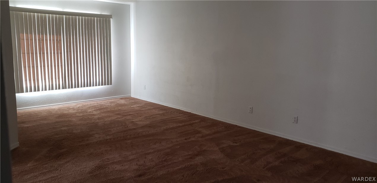 10002 East Blake Ranch Road, Unit 3 Kingman, AZ 86401 - Photo 18 of 42 a view of empty room with windows