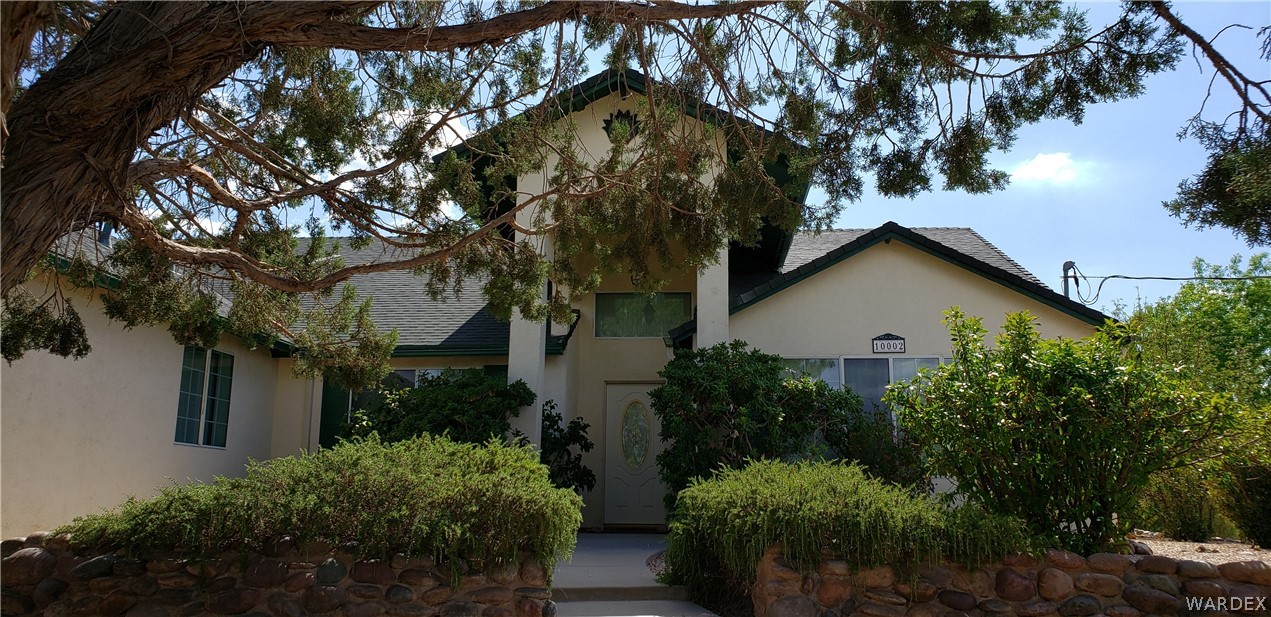 10002 East Blake Ranch Road, Unit 3 Kingman, AZ 86401 - Photo 2 of 42 a view of a house with a tree