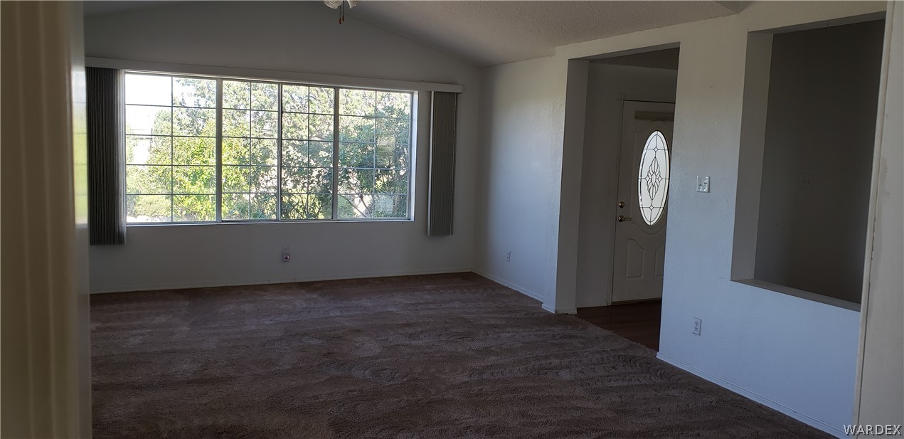 10002 East Blake Ranch Road, Unit 3 Kingman, AZ 86401 - Photo 4 of 42 an empty room with windows and closet