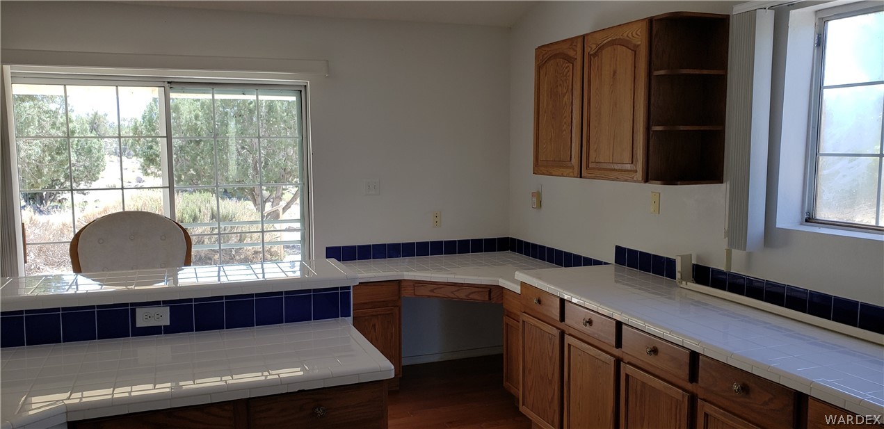 10002 East Blake Ranch Road, Unit 3 Kingman, AZ 86401 - Photo 9 of 42 a kitchen with a sink and a window