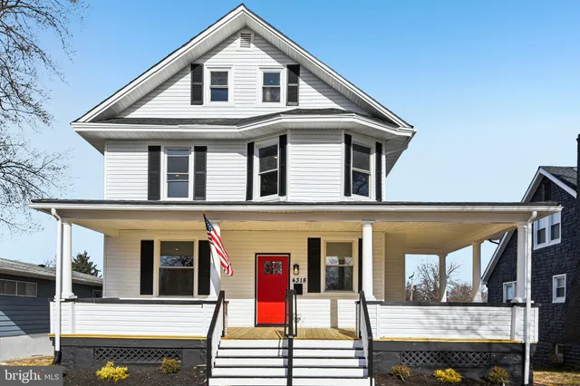 a front view of a house with large windows