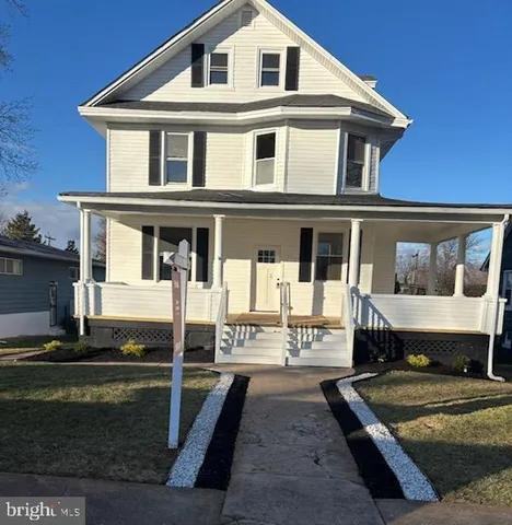 a front view of a house with yard