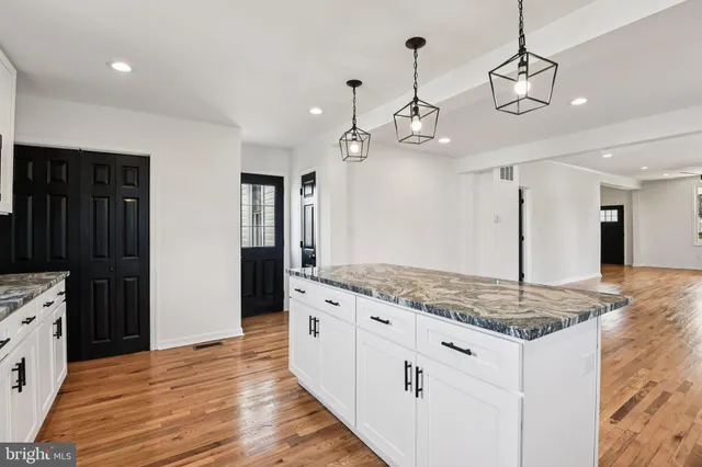 a view of a hallway with wooden shelves