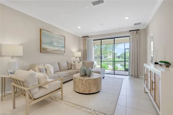 a living room with furniture and a window