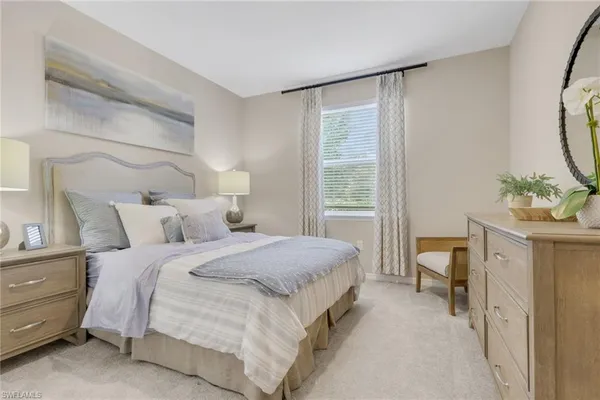 a bed room with a bed and a window