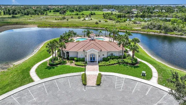 an aerial view of a house with a lake view