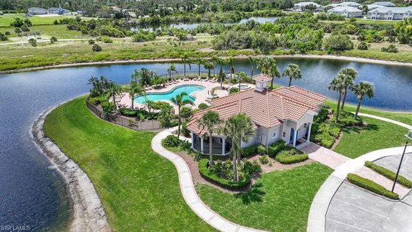 an aerial view of residential house with outdoor space and swimming pool