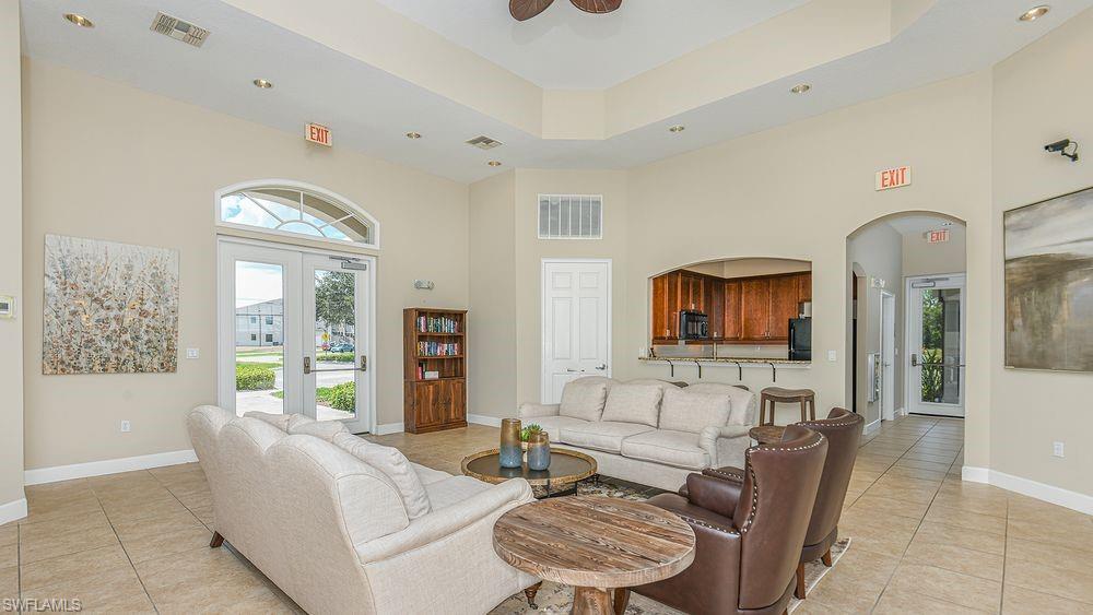 23955 Collina Way, Unit 104 Punta Gorda, FL 33980 - Photo 36 of 45 a living room with furniture and a flat screen tv