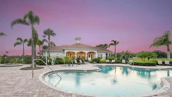 a view of a lake with a house in the background