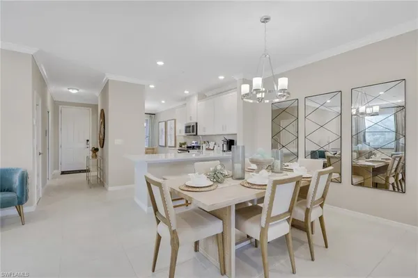 a dining room with furniture and window