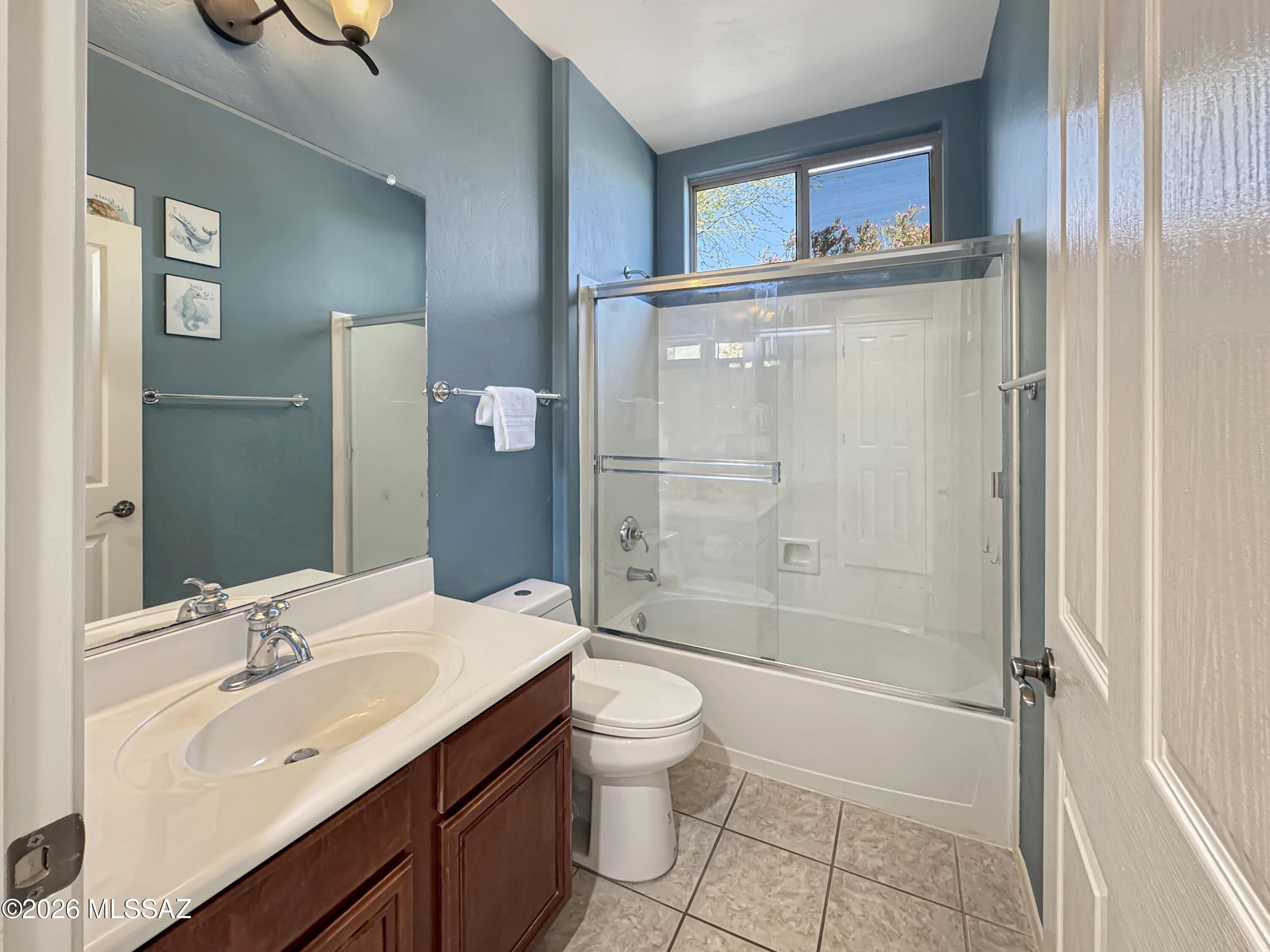 10835 South Heart Break Ridge Place Vail, AZ 85641 - Photo 30 of 49 a bathroom with a sink a toilet and shower