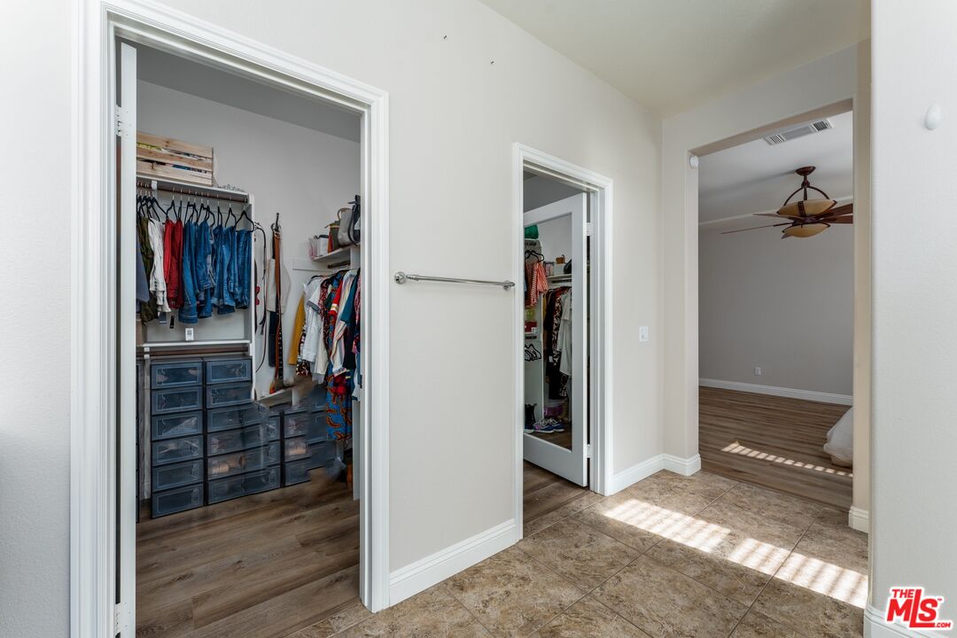 14775 Prairie Smoke Road Eastvale, CA 92880 - Photo 19 of 36 a view of a hallway with closet and a window