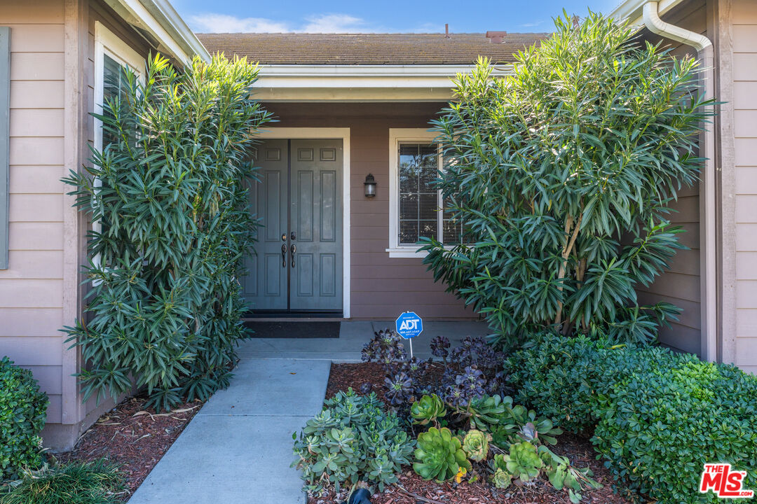 14775 Prairie Smoke Road Eastvale, CA 92880 - Photo 2 of 36 a view of a house with potted plants