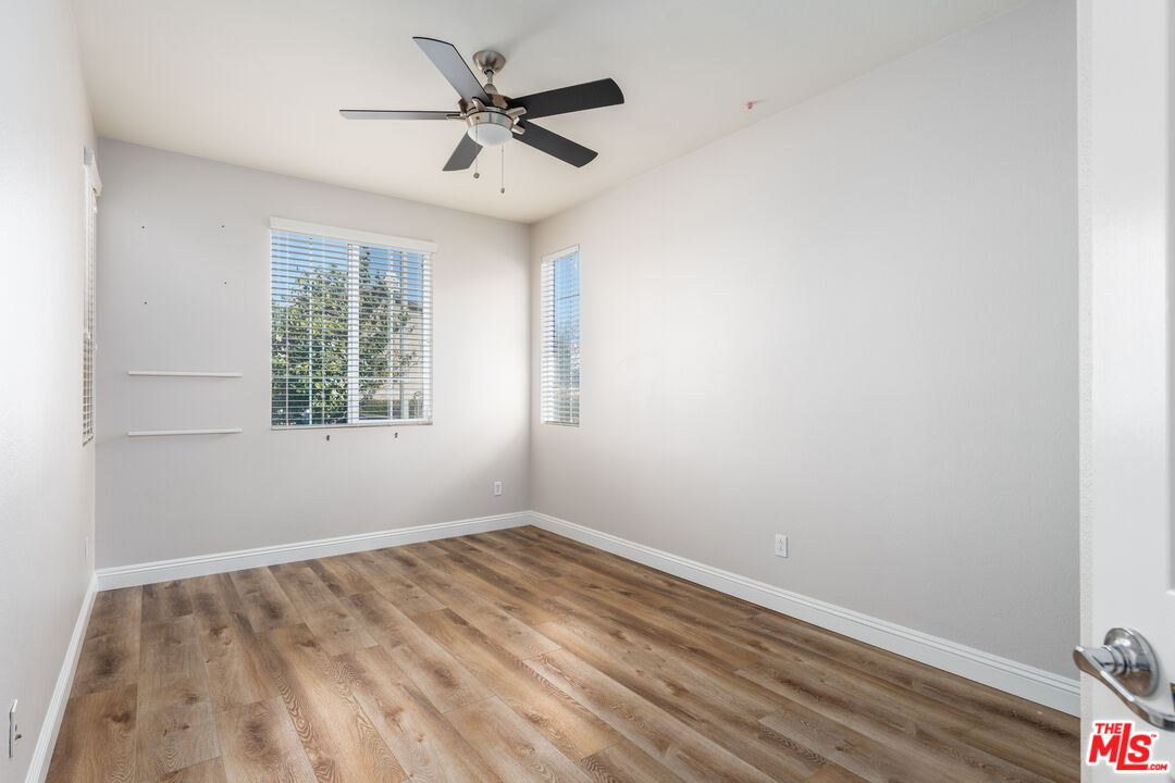 14775 Prairie Smoke Road Eastvale, CA 92880 - Photo 23 of 36 an empty room with a window and a fan