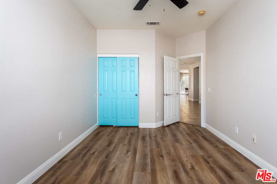 14775 Prairie Smoke Road Eastvale, CA 92880 - Photo 24 of 36 a view of hallway with wooden floor