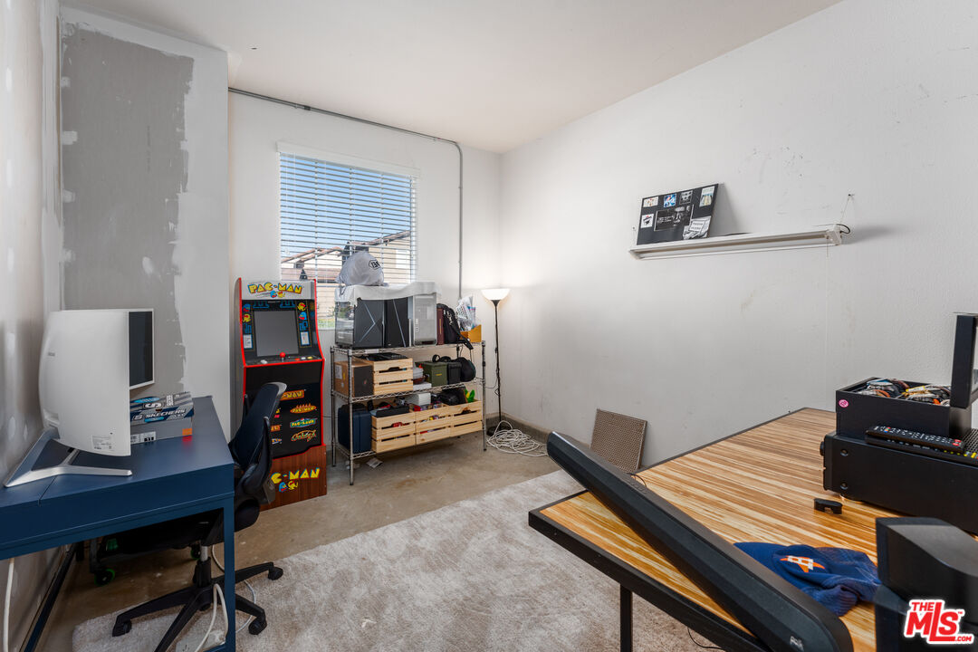 14775 Prairie Smoke Road Eastvale, CA 92880 - Photo 25 of 36 a view of a workspace with furniture and a window