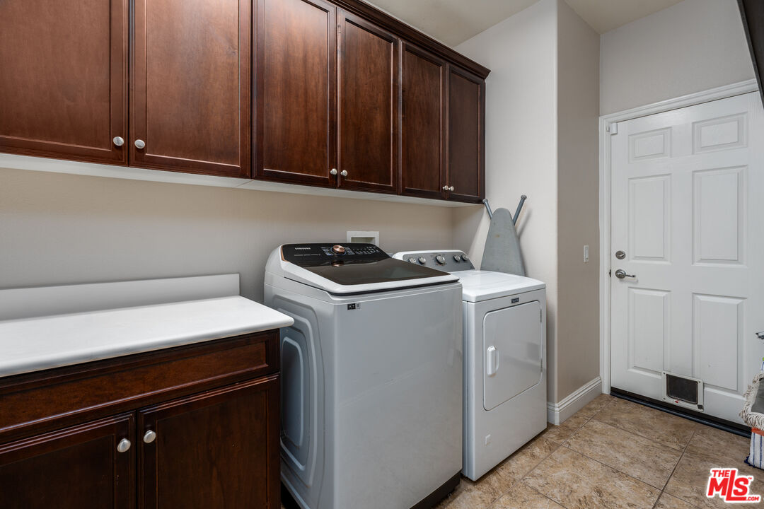 14775 Prairie Smoke Road Eastvale, CA 92880 - Photo 27 of 36 a utility room with dryer and washer