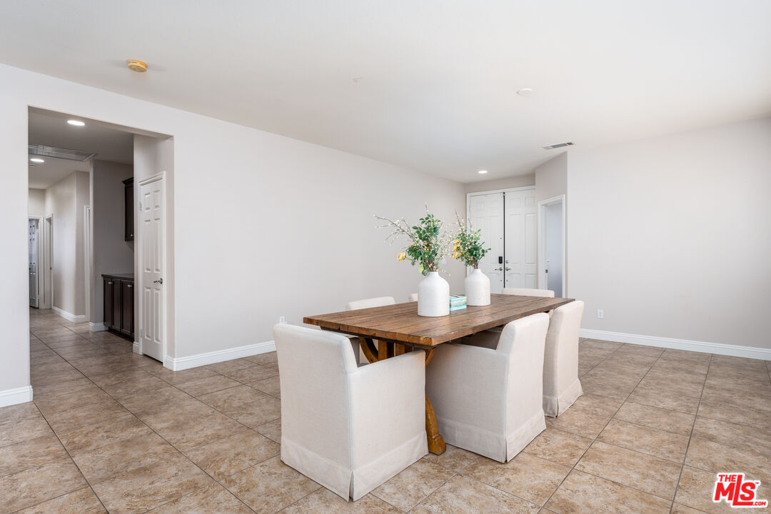14775 Prairie Smoke Road Eastvale, CA 92880 - Photo 3 of 36 a view living room with a sink and cabinets