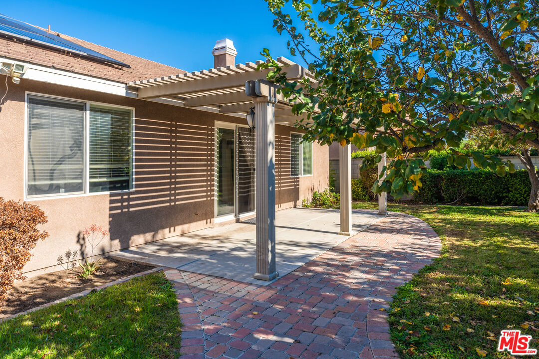 14775 Prairie Smoke Road Eastvale, CA 92880 - Photo 31 of 36 a view of a house with backyard and a tree