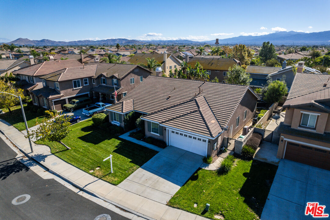 14775 Prairie Smoke Road Eastvale, CA 92880 - Photo 36 of 36 an aerial view of multiple houses with yard
