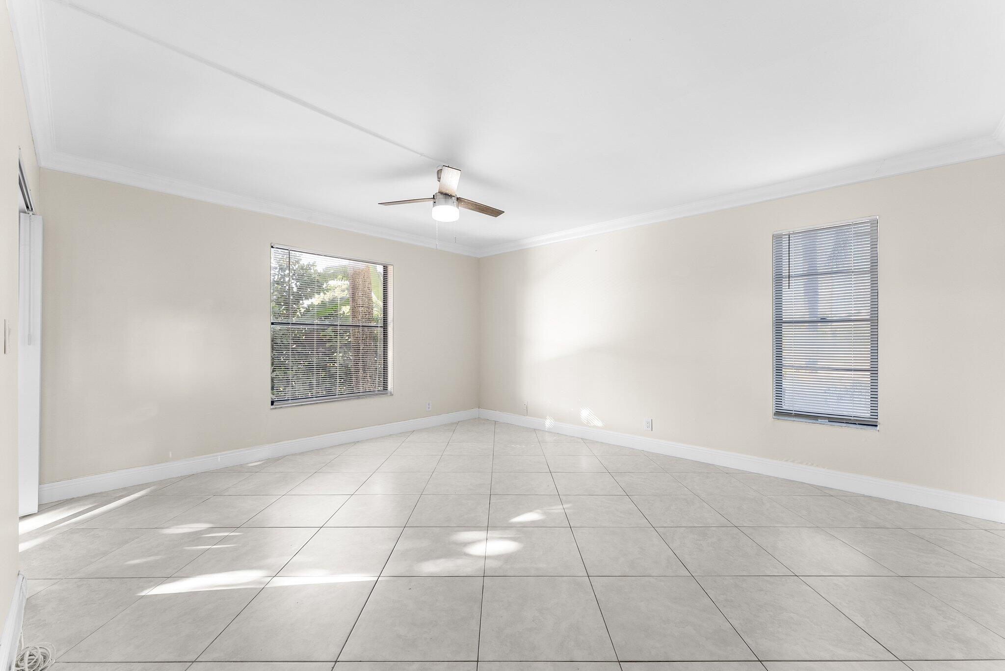 23490 Lyons Road, Unit 605 Boca Raton, FL 33428 - Photo 12 of 39 a view of an empty room with a window