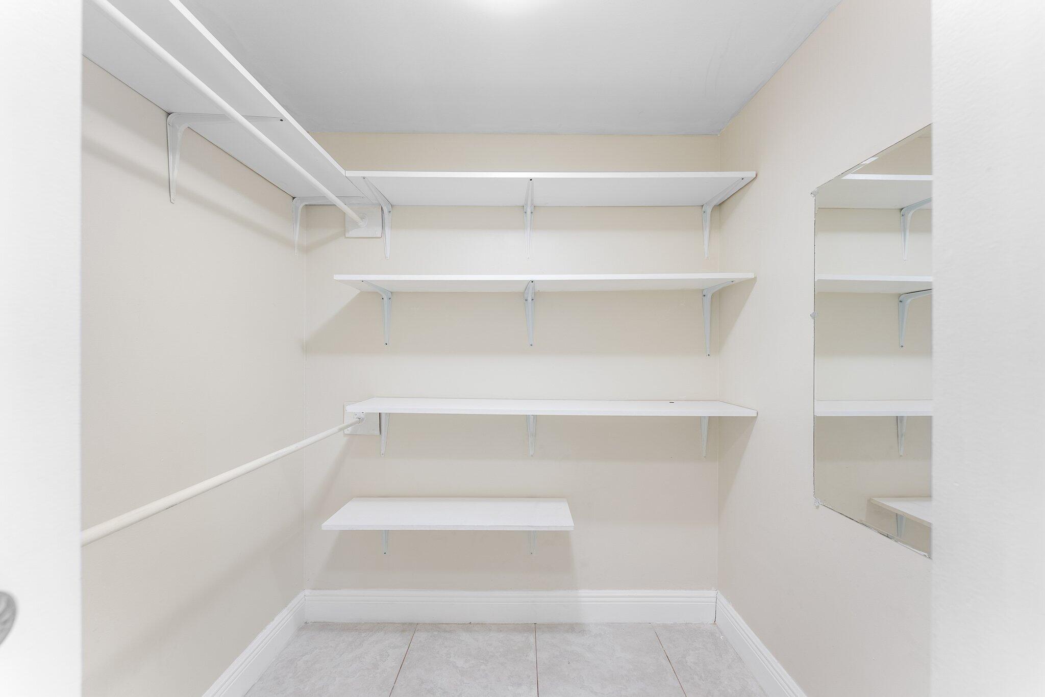23490 Lyons Road, Unit 605 Boca Raton, FL 33428 - Photo 15 of 39 a view of a room with shelf
