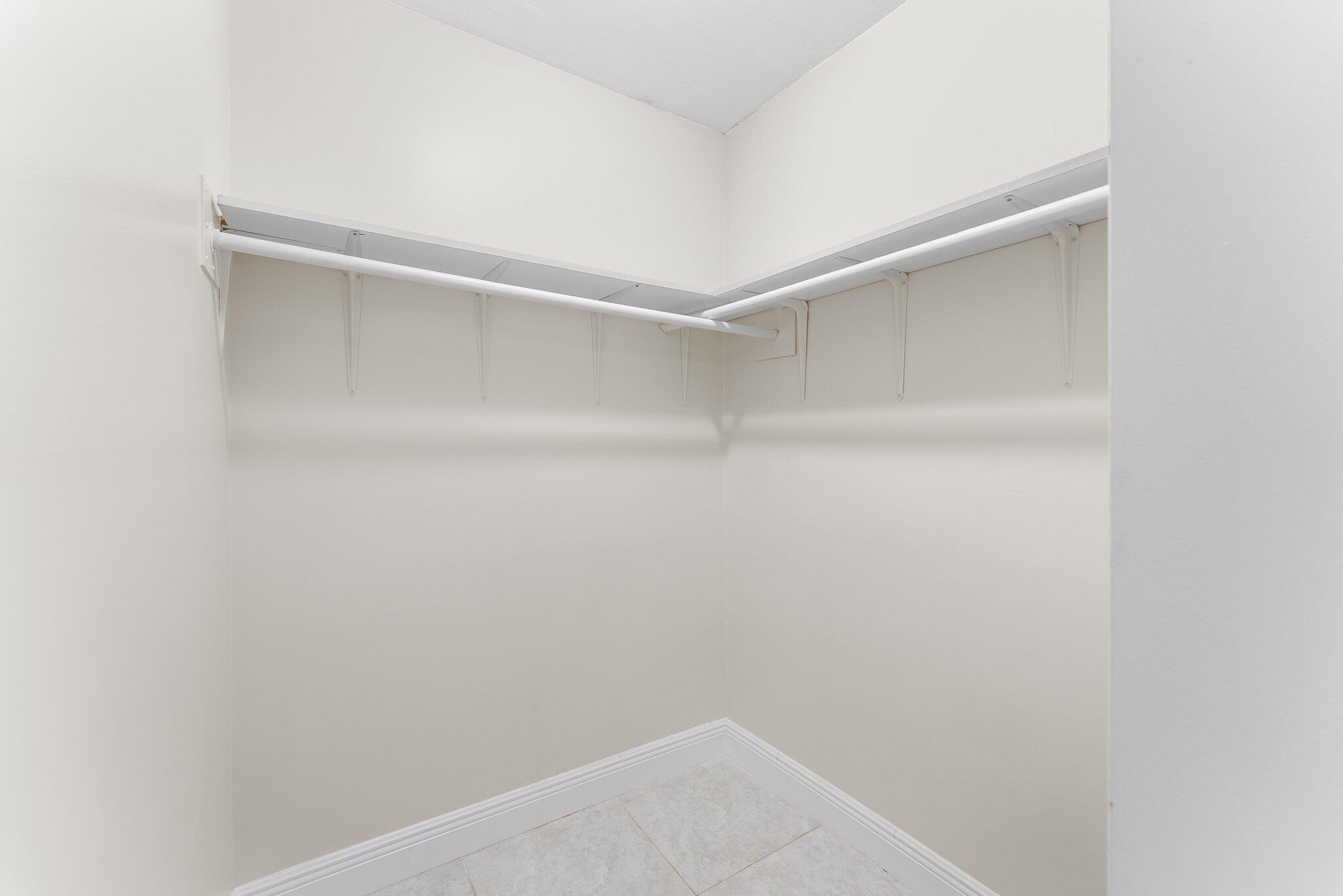 23490 Lyons Road, Unit 605 Boca Raton, FL 33428 - Photo 20 of 39 a view of an empty walk in closet