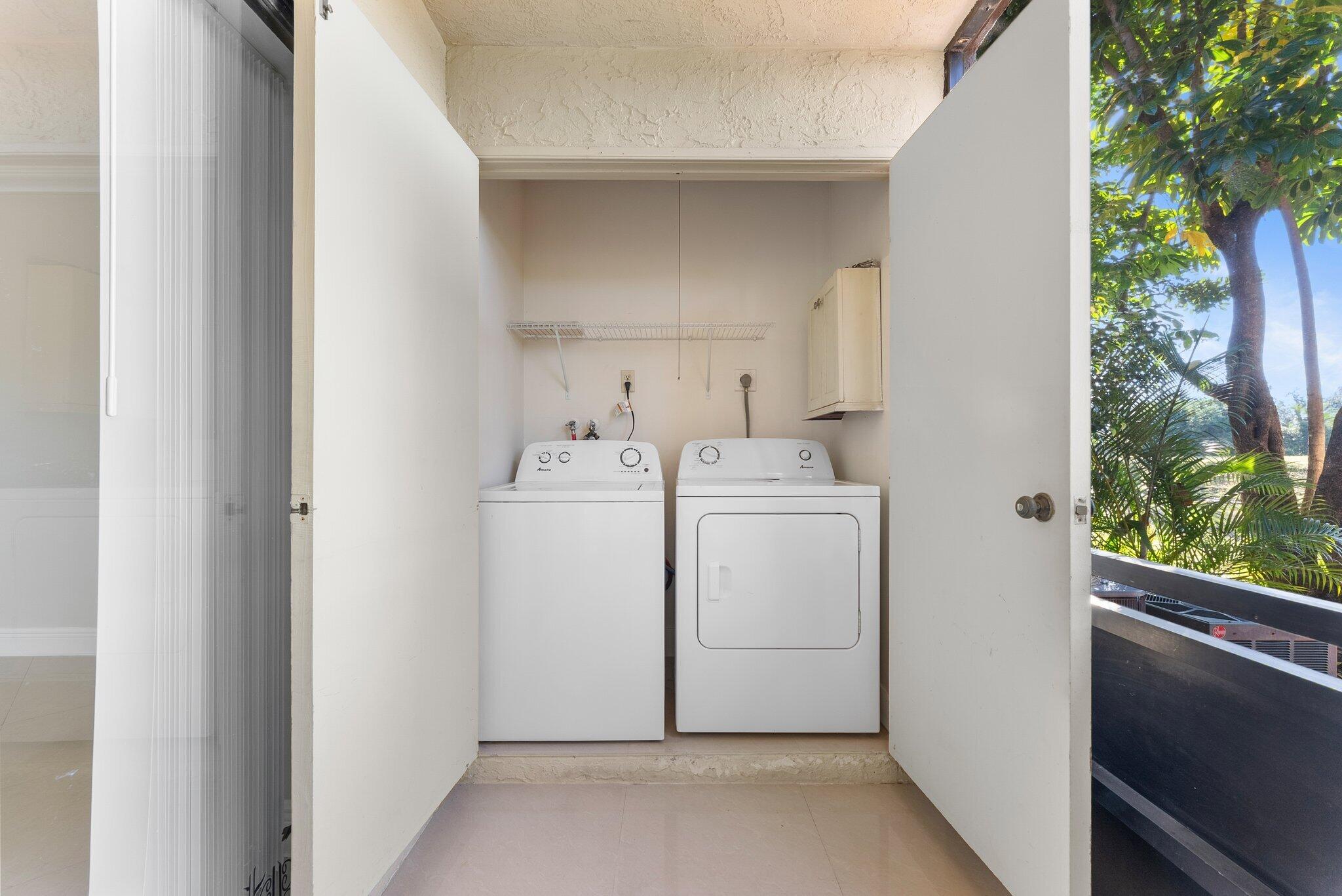 23490 Lyons Road, Unit 605 Boca Raton, FL 33428 - Photo 21 of 39 a utility room with dryer and washer
