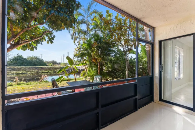 a view of two chairs in a balcony