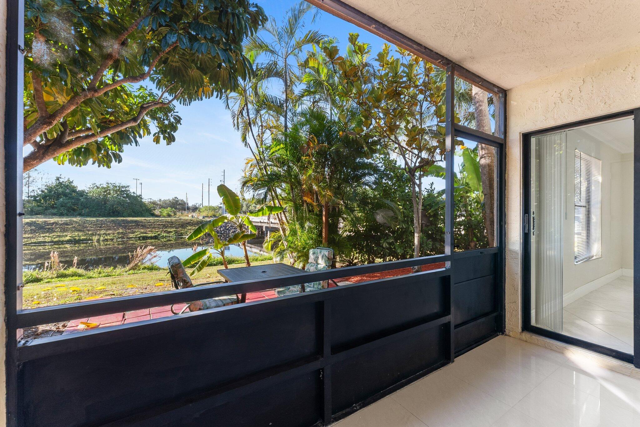 23490 Lyons Road, Unit 605 Boca Raton, FL 33428 - Photo 22 of 39 a view of two chairs in a balcony