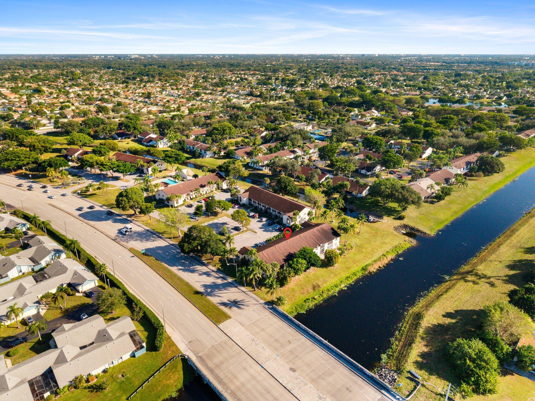 23490 Lyons Road, Unit 605 Boca Raton, FL 33428 - Photo 32 of 39 an aerial view of residential houses with outdoor space