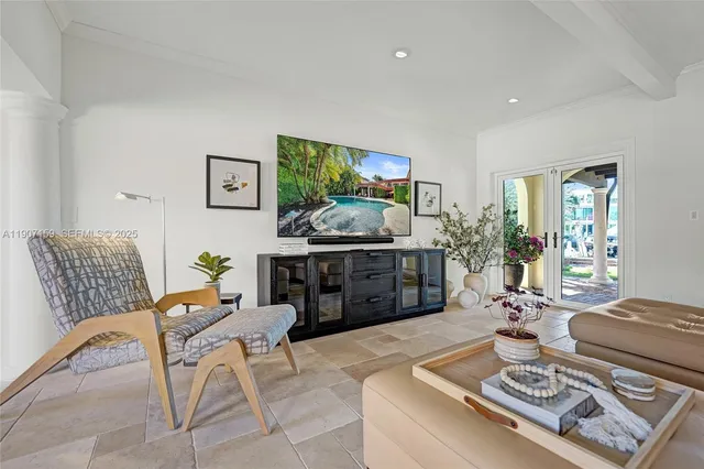 a kitchen with kitchen island a stove a sink a refrigerator and cabinets