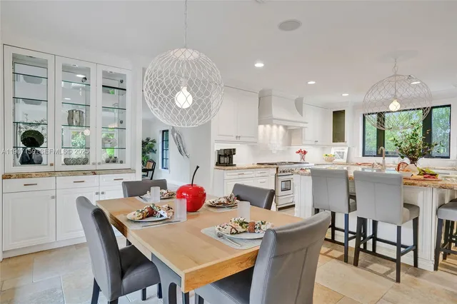 a bathroom with a granite countertop sink toilet a mirror and shower