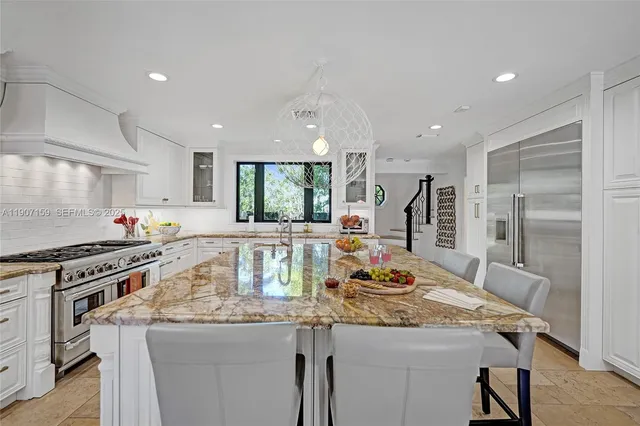 a bathroom with a sink toilet vanity and shower