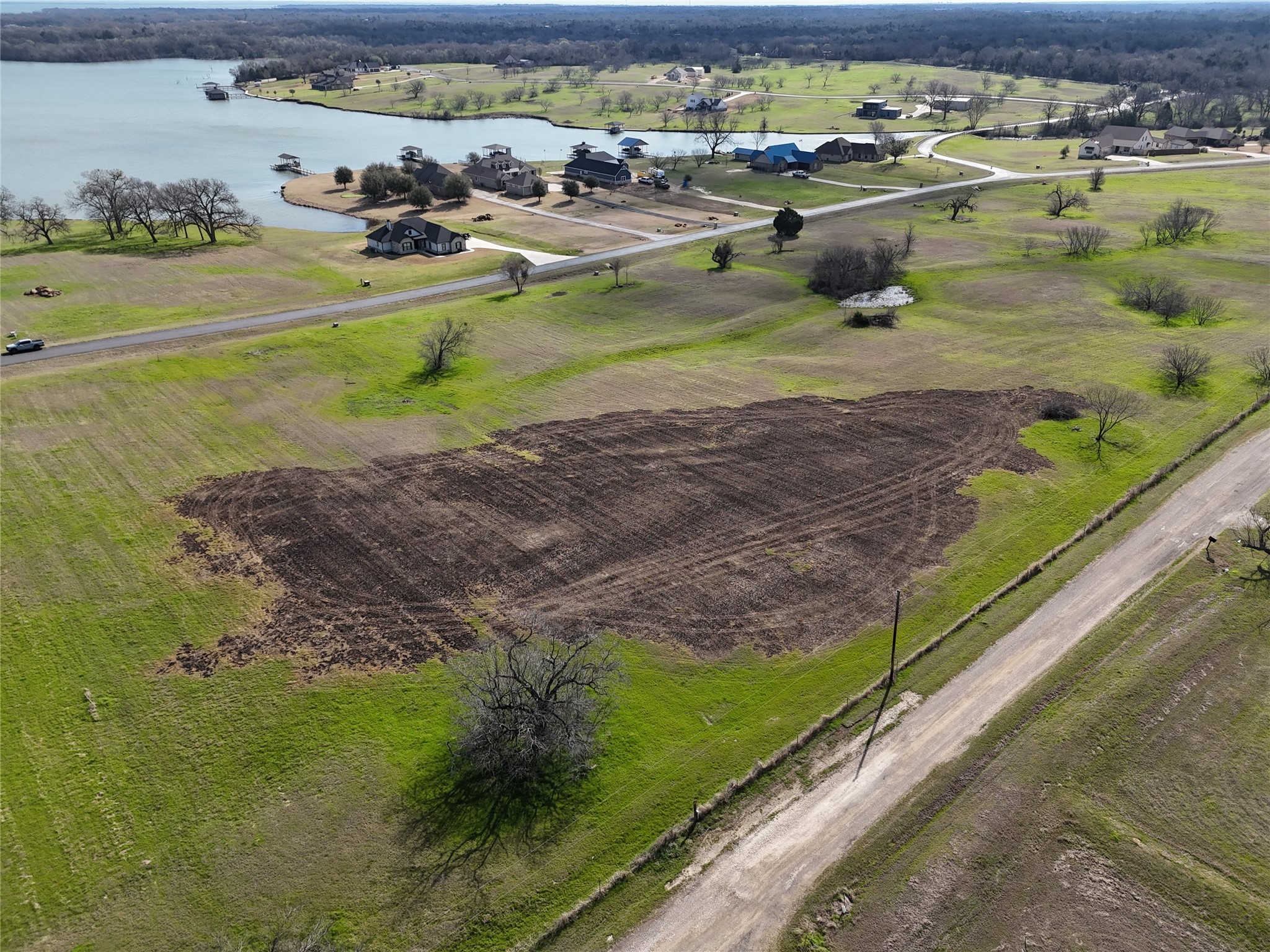 21 Open Water Way Streetman, TX 75859 - Photo 14 of 14 a view of a lake with a houses