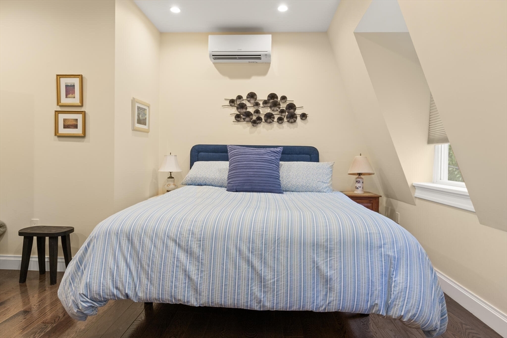 125 Heath Street Somerville, MA 02145 - Photo 22 of 42 a bedroom with a bed and a table