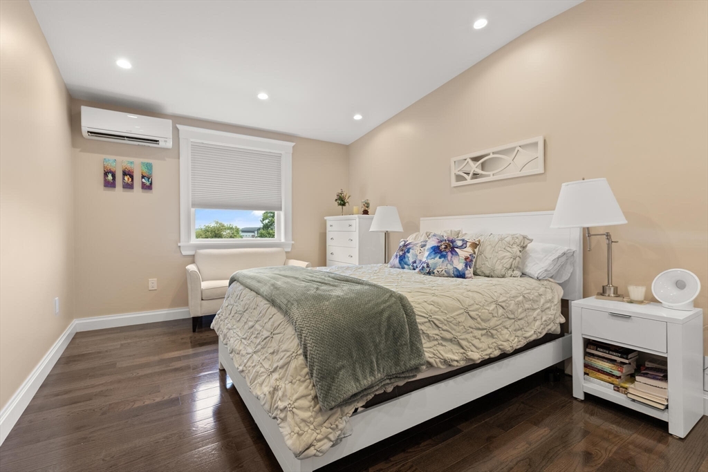 125 Heath Street Somerville, MA 02145 - Photo 26 of 42 a bedroom with a bed and a window