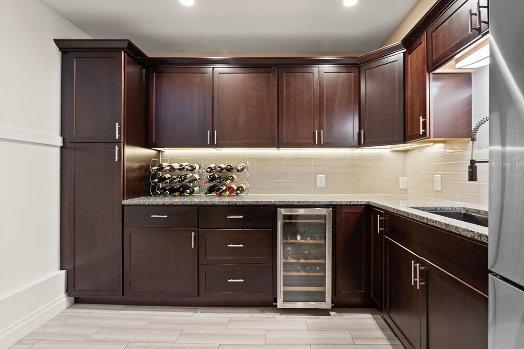 125 Heath Street Somerville, MA 02145 - Photo 30 of 42 a kitchen with a sink and cabinets