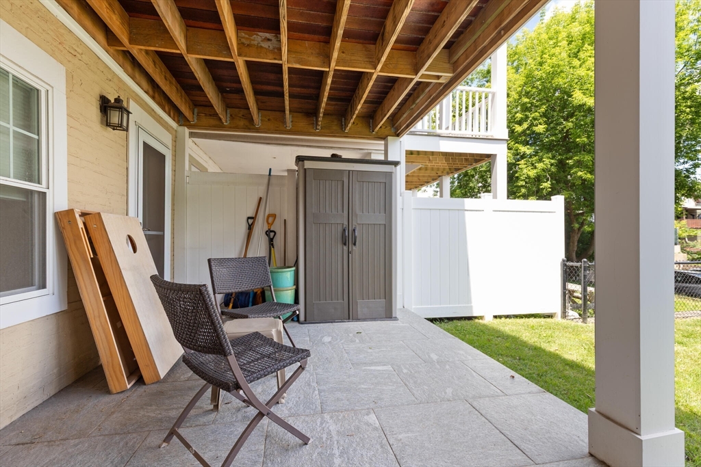 125 Heath Street Somerville, MA 02145 - Photo 37 of 42 a view of a porch with furniture and floor to ceiling window