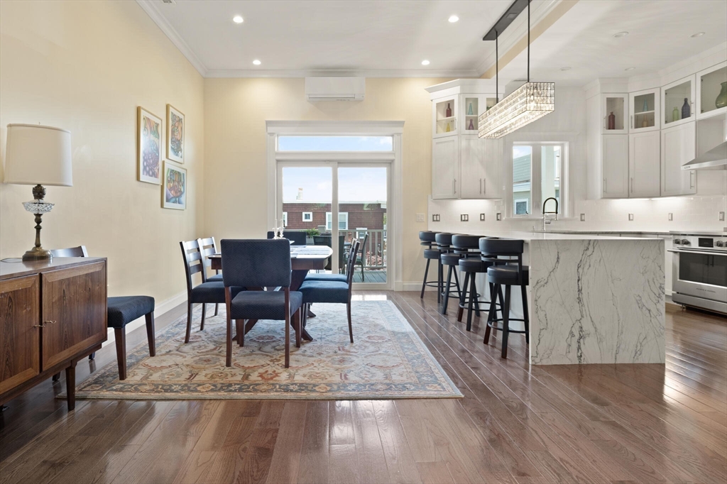 125 Heath Street Somerville, MA 02145 - Photo 10 of 42 a view of a a dining room with furniture window and wooden floor