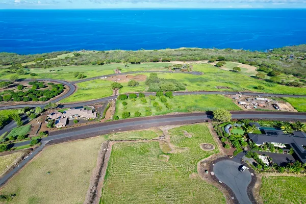 a view of a garden with an ocean view