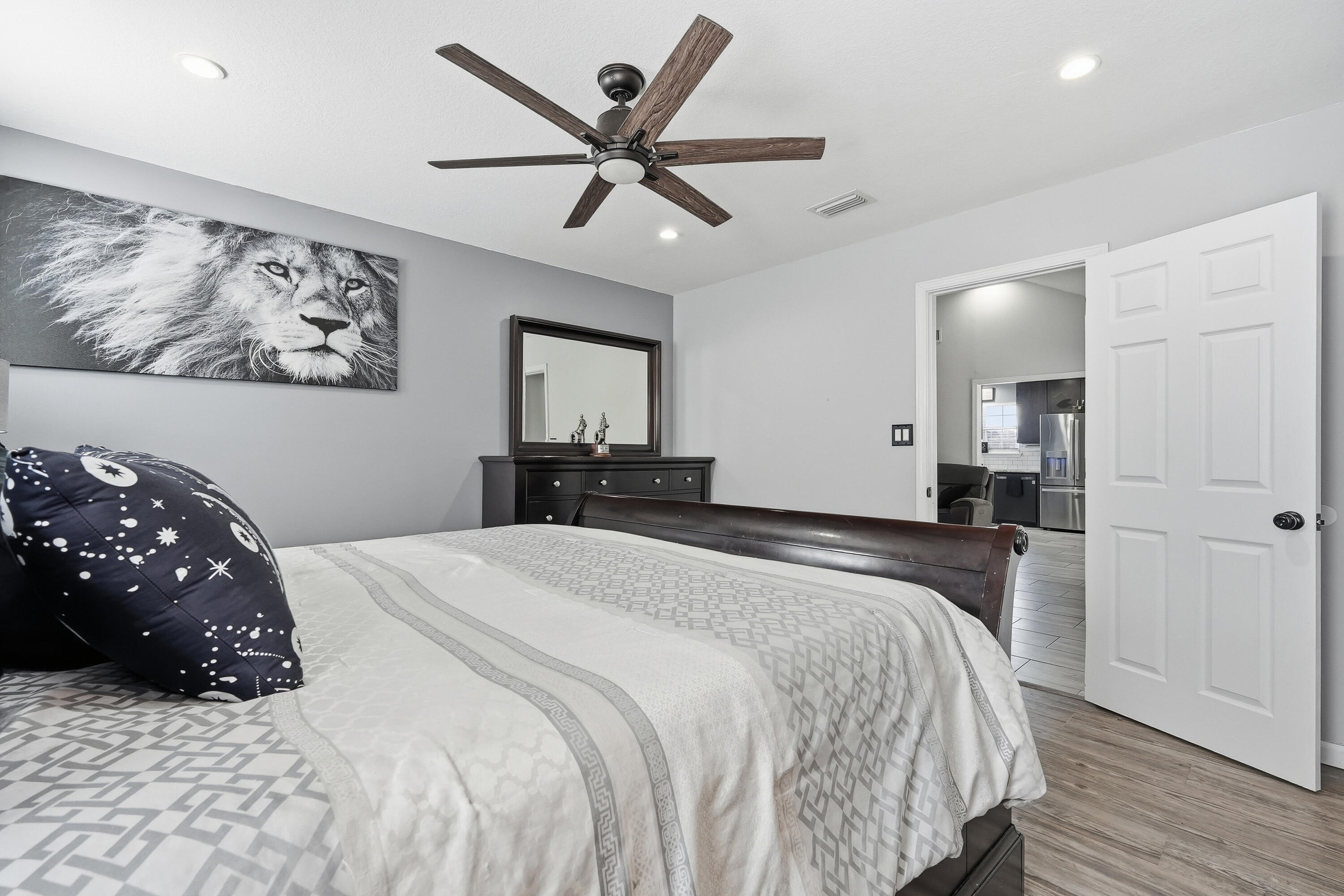 428 Sandy Ridge Circle Mary Esther, FL 32569 - Photo 14 of 44 a bedroom with a large bed and a chandelier