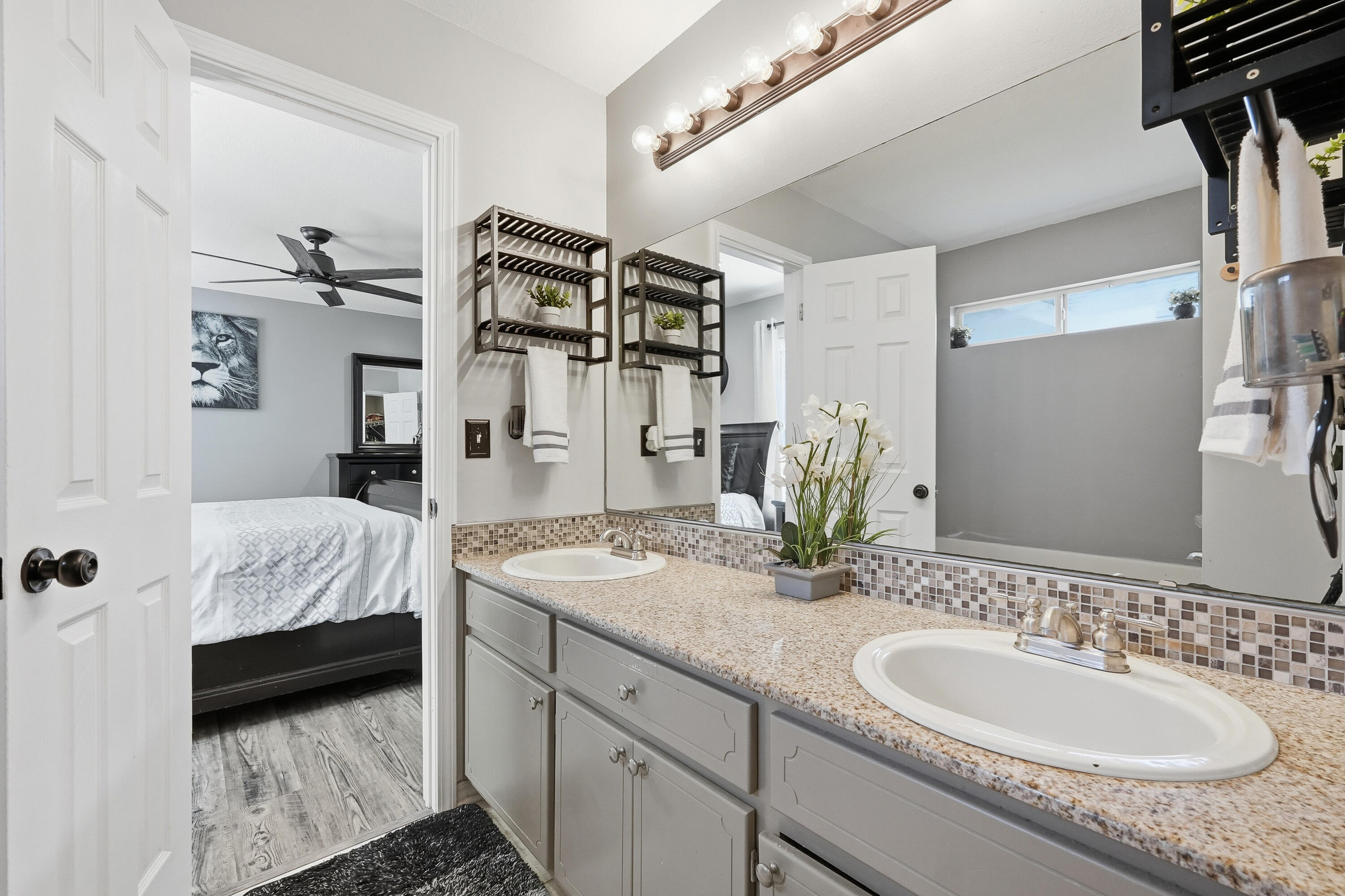 428 Sandy Ridge Circle Mary Esther, FL 32569 - Photo 16 of 44 a en suite bathroom with a granite countertop sink and a mirror