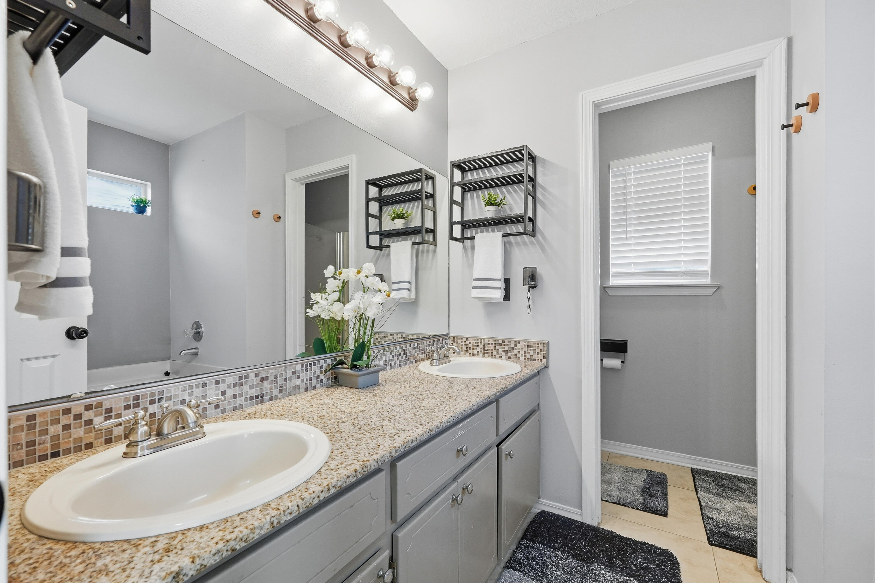 428 Sandy Ridge Circle Mary Esther, FL 32569 - Photo 19 of 44 a bathroom with a granite countertop sink and a mirror