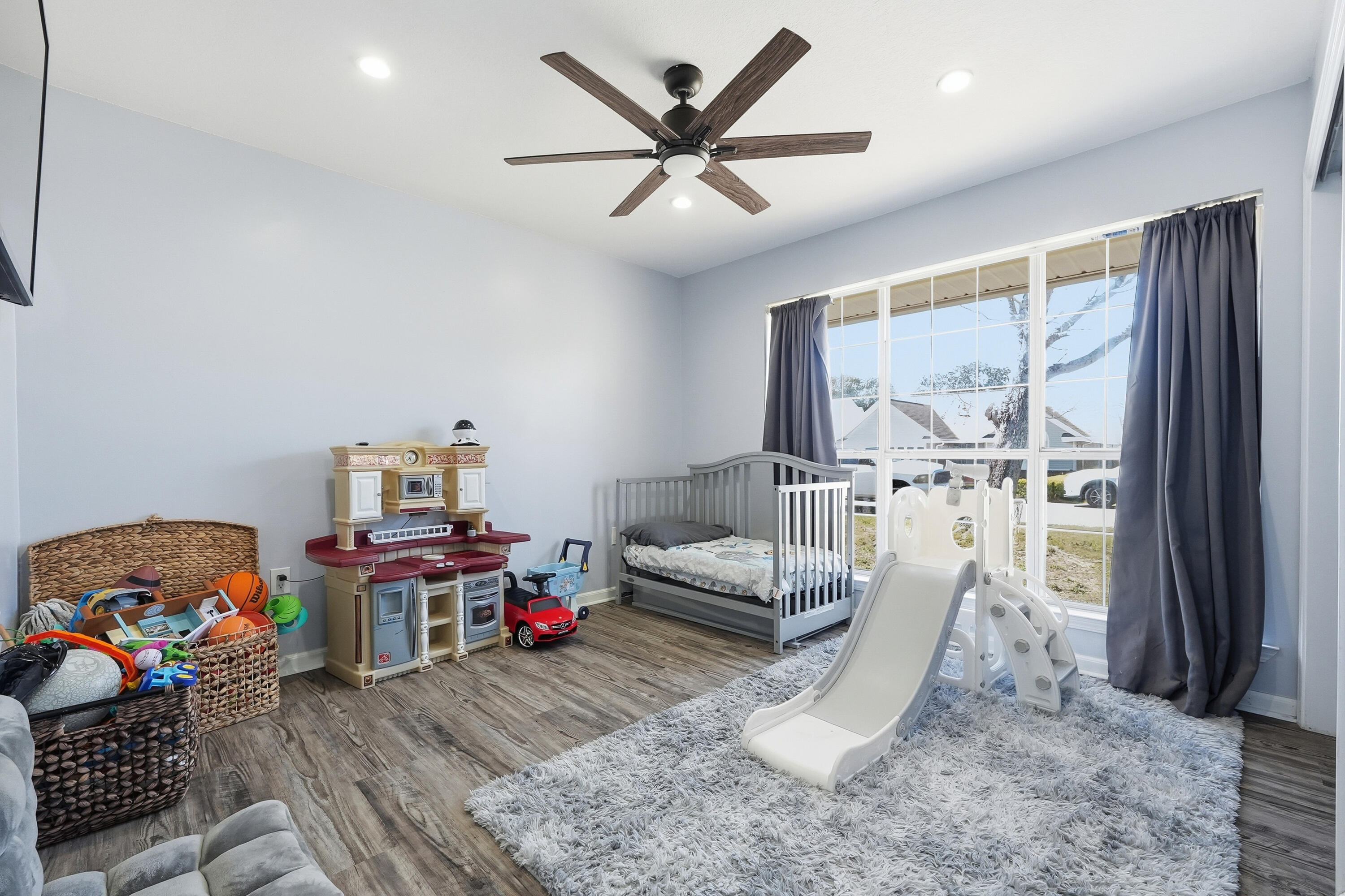 428 Sandy Ridge Circle Mary Esther, FL 32569 - Photo 20 of 44 a living room with furniture and a floor to ceiling window