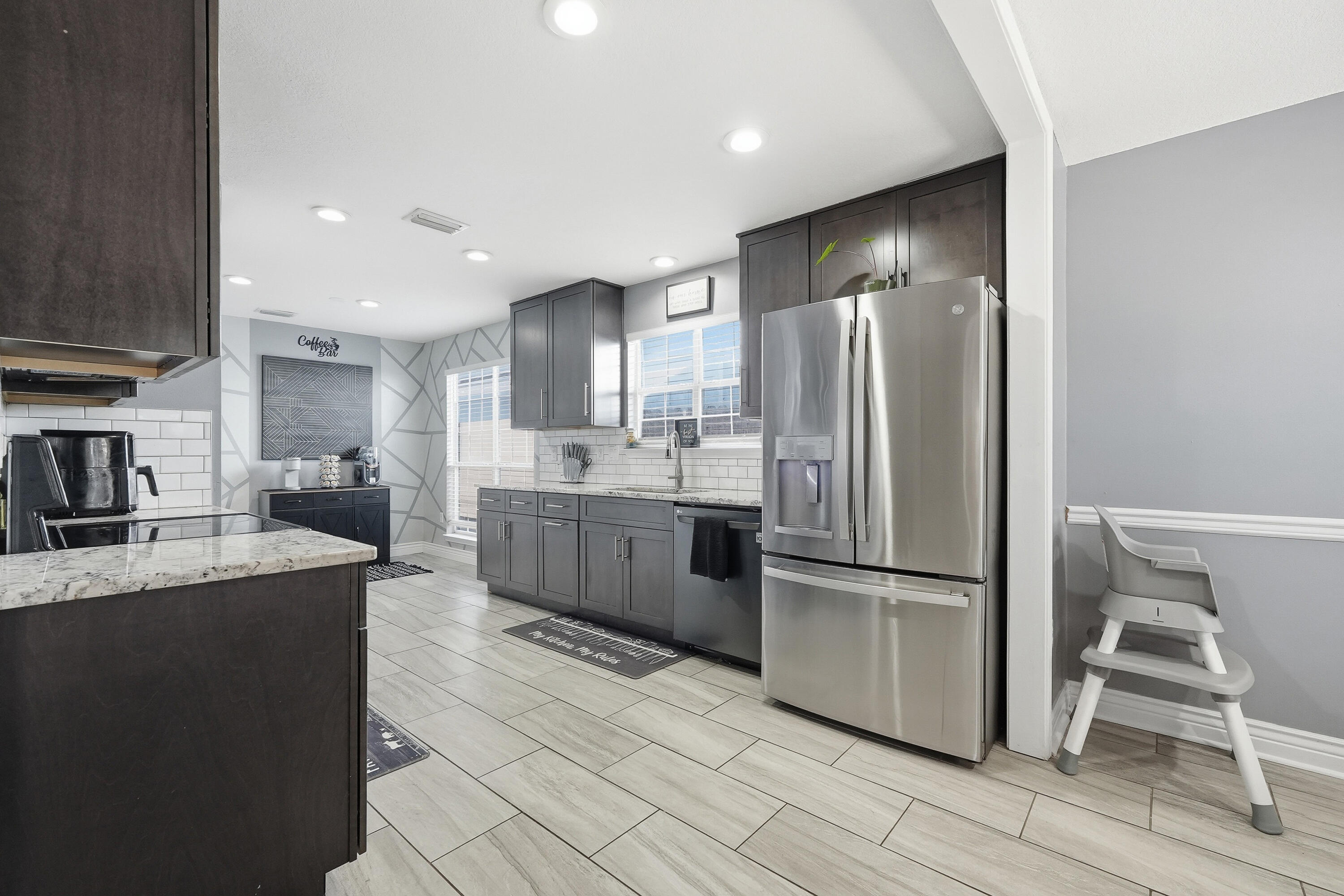 428 Sandy Ridge Circle Mary Esther, FL 32569 - Photo 28 of 44 a kitchen with stainless steel appliances granite countertop a refrigerator a stove and a sink