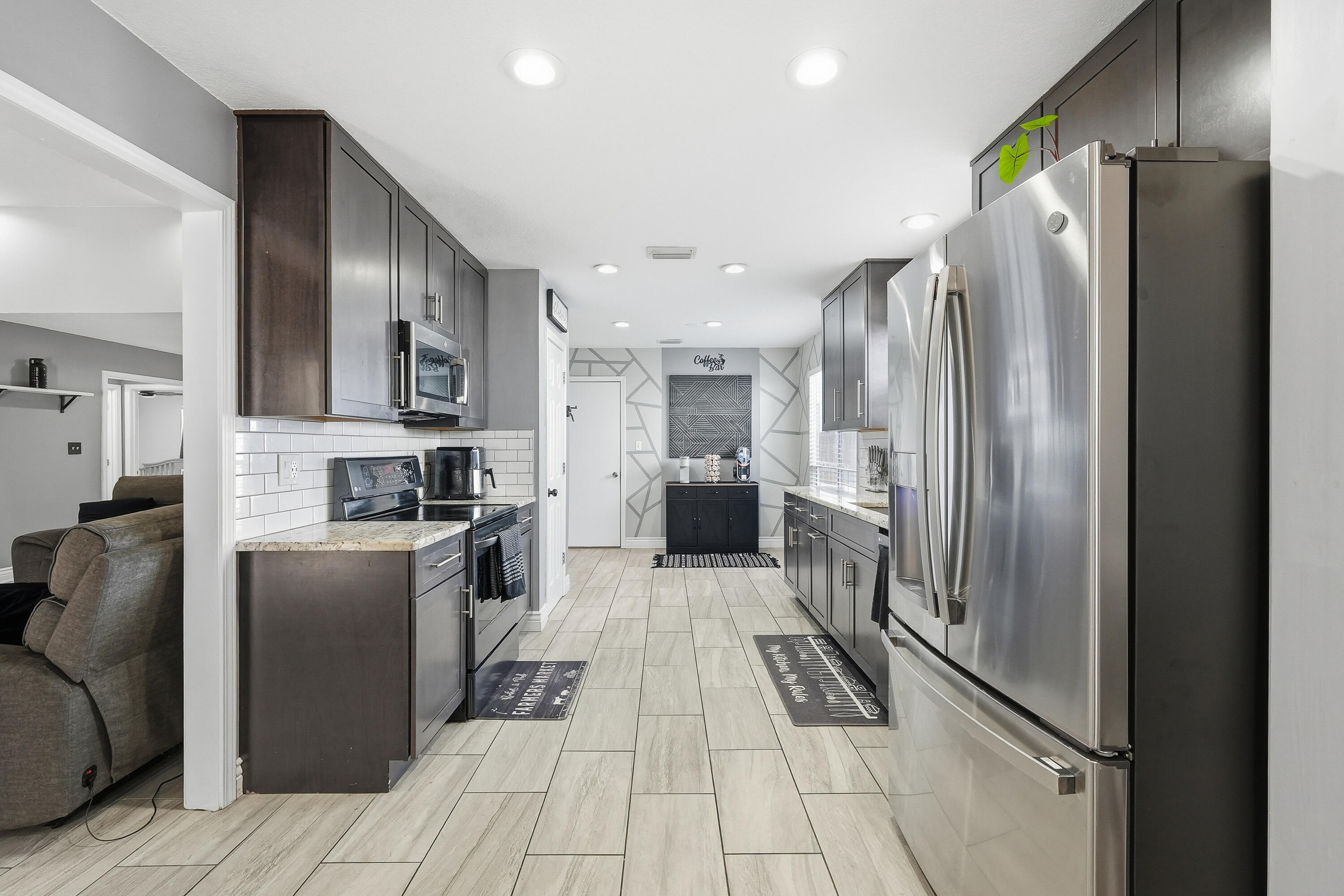 428 Sandy Ridge Circle Mary Esther, FL 32569 - Photo 29 of 44 a kitchen with stainless steel appliances granite countertop a refrigerator and a stove top oven