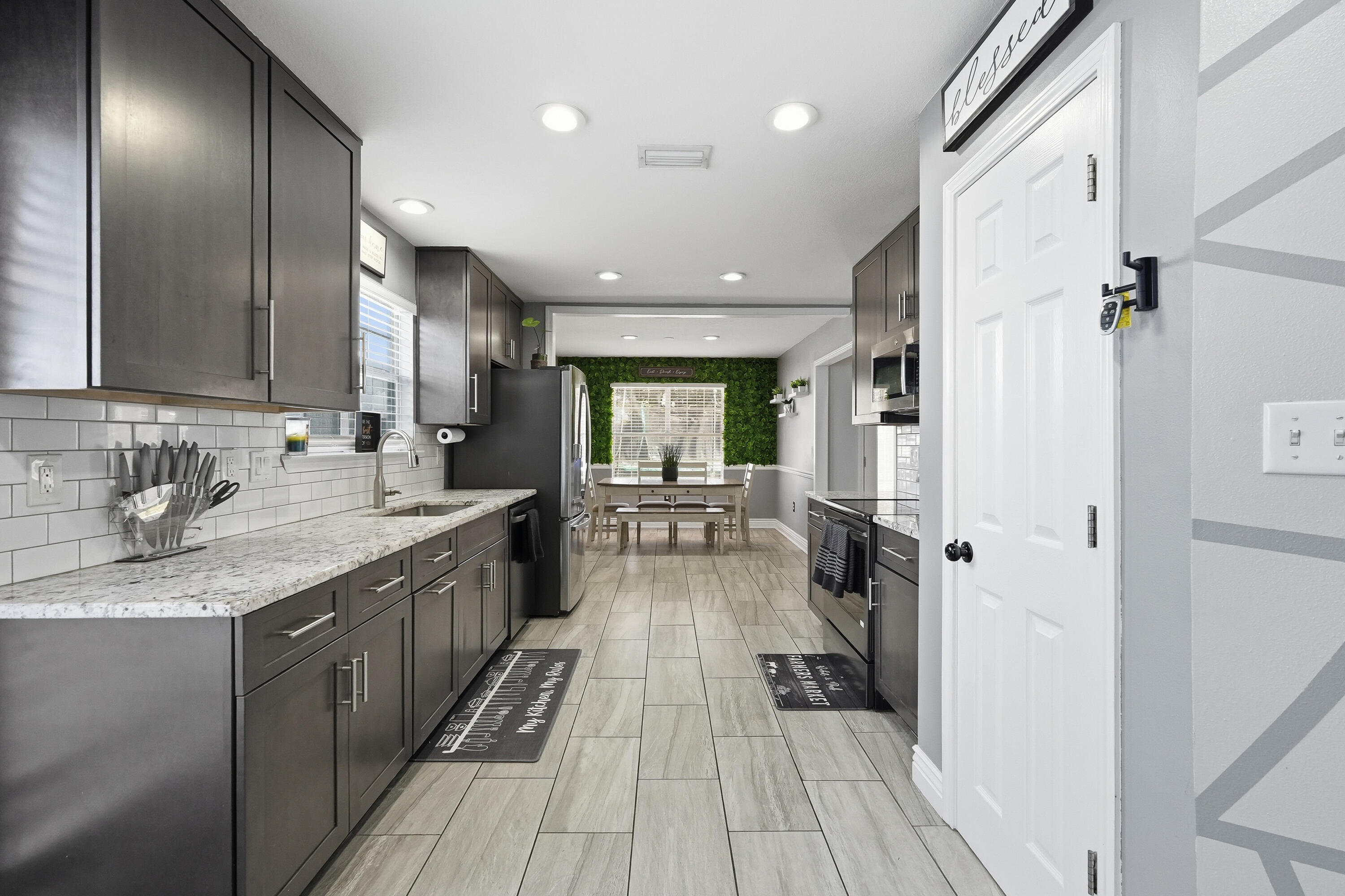 428 Sandy Ridge Circle Mary Esther, FL 32569 - Photo 35 of 44 a large kitchen with a large counter top a sink stainless steel appliances and cabinets
