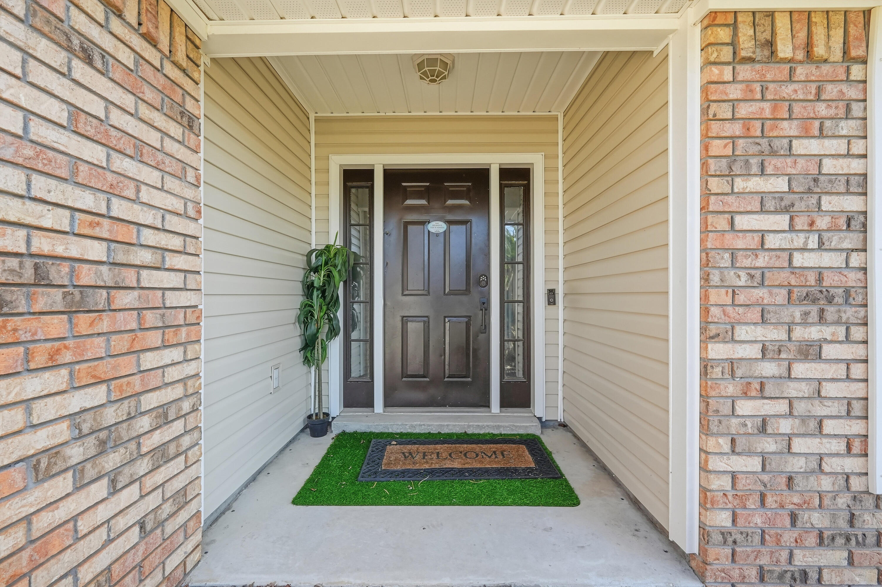 428 Sandy Ridge Circle Mary Esther, FL 32569 - Photo 7 of 44 a front view of a house with garden